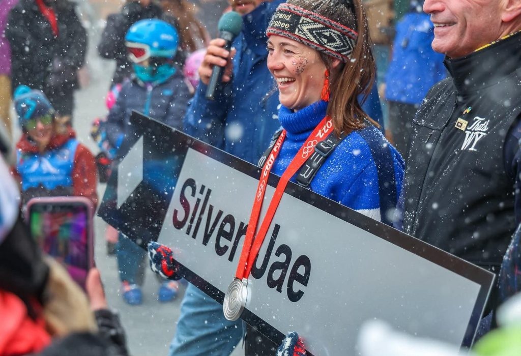 Photo of Jaelin Kauf holding a Silver Jae ski run sign
