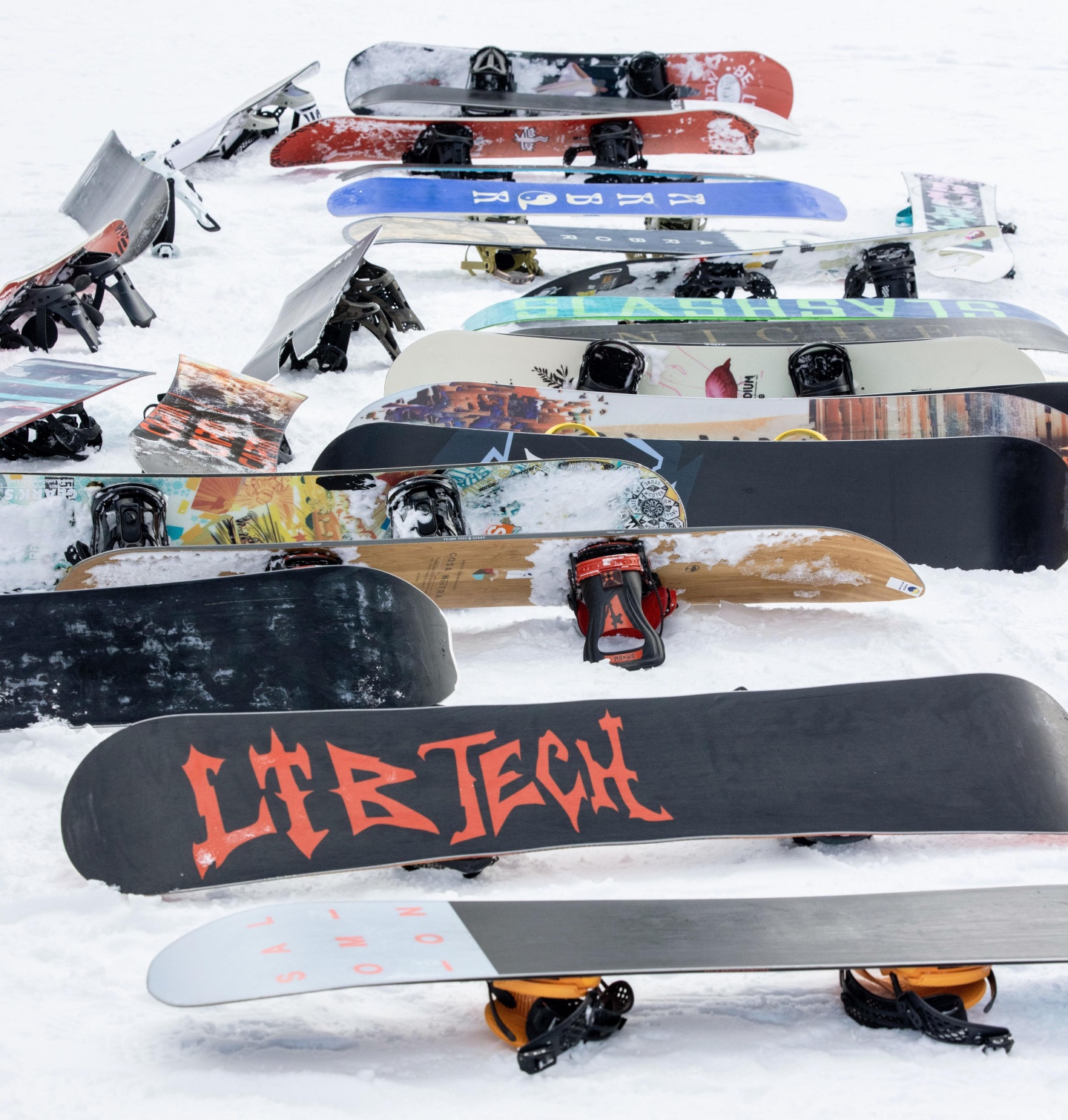 Snowboards laying on snow