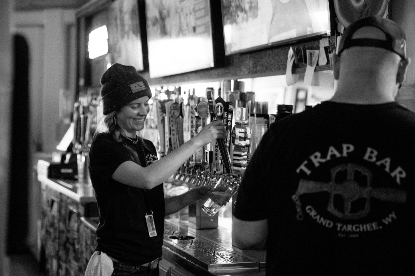 Bar staff pouring pints